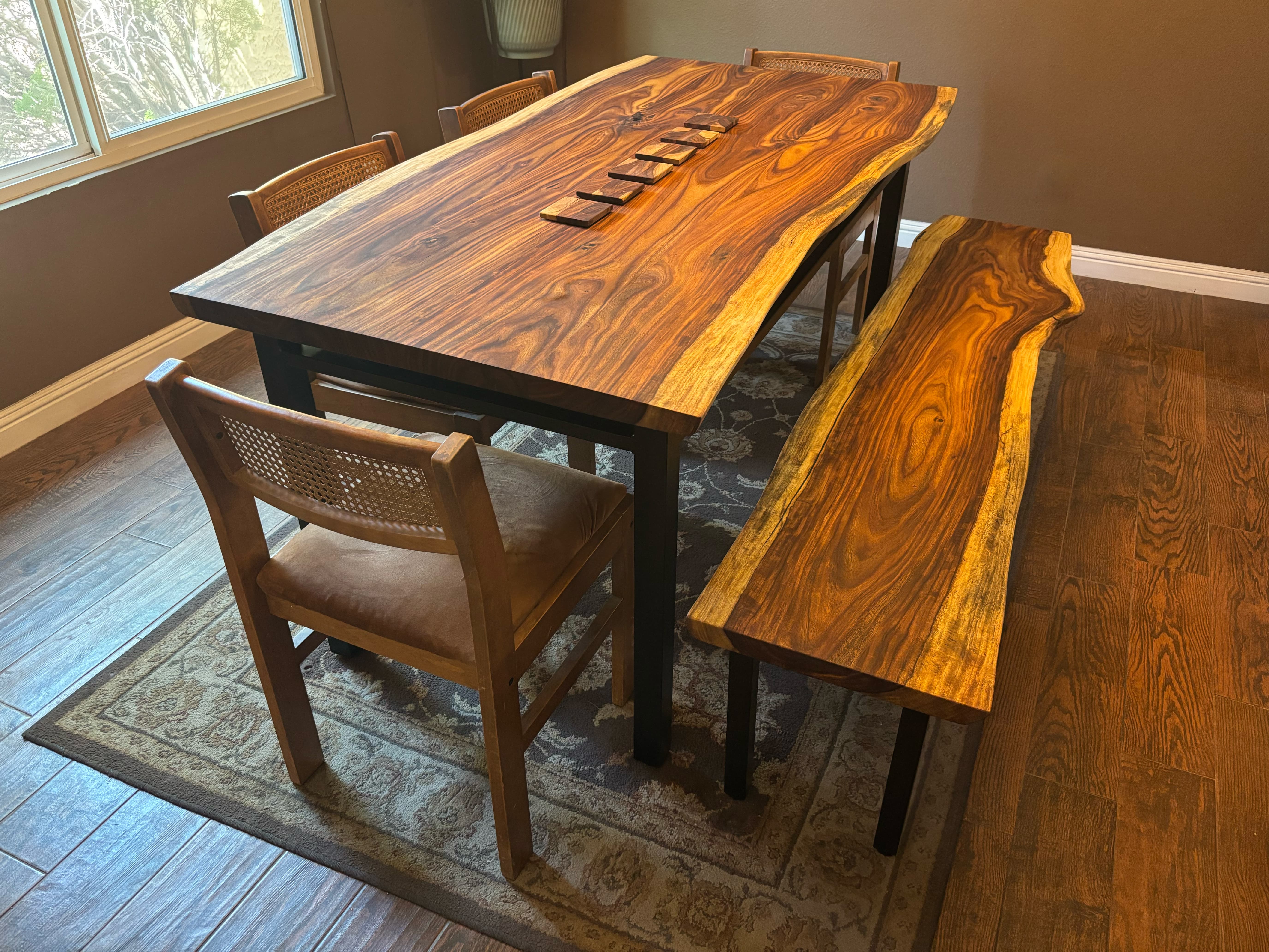 The finished set at home — table, bench, and chairs